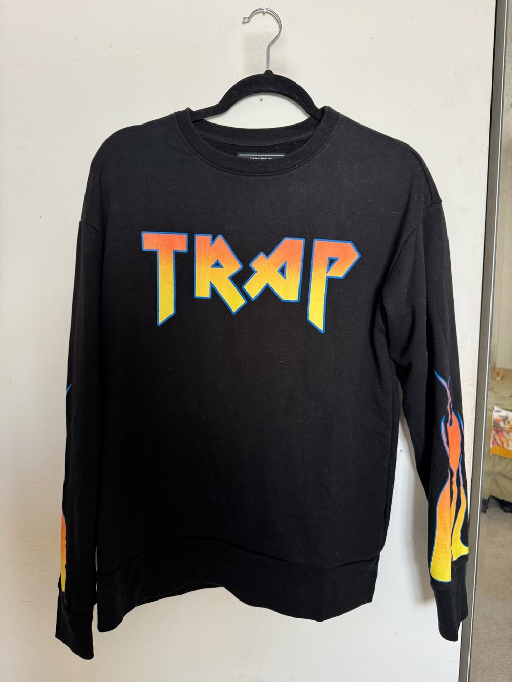 Forever 21 Black Crewneck Sweater with Yellow-Orange Gradient "TRAP" Print
